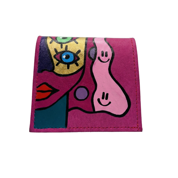Hand-painted pink  leather wallet with cubist abstract portrait, green cheek, and white polka dots. Signed by Rime Sbai.