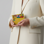 Hand-painted beige leather wallet with cubist abstract portrait, green cheek, and white polka dots. Signed by Rime Sbai.