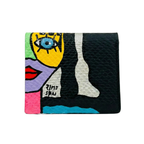 Textured black leather wallet featuring a neon yellow and purple abstract face, signed by Rime Sbai